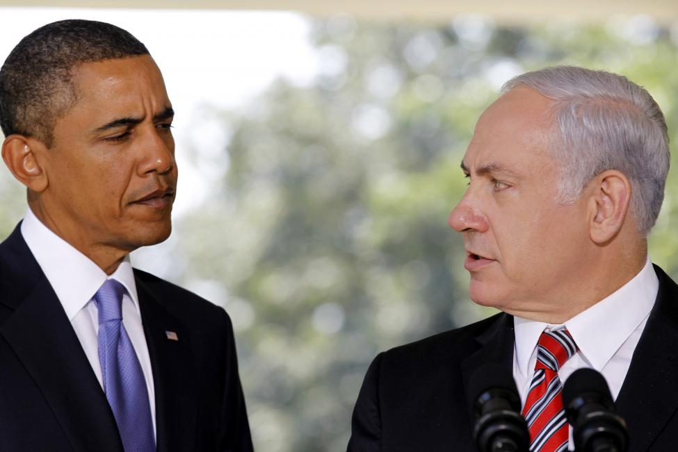 US President Obama listens as Israeli PM Netanyahu delivers a statement in Washington