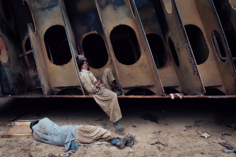 Men rest at the Gadani ship breaking yard, Balochistan Province, Pakistan on August 16, 2011.